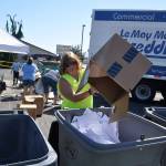 Christy Francis with Castell Insurance dumps documents for shredding at Castell Insurances annual shred event. This year, organizers host the free event with no limit from 8 a.m.-11 a.m. Saturday, Aug. 11, with monetary and school supply donations supporting the Boys & Girls Clubs Back to School Fair. Submitted photo