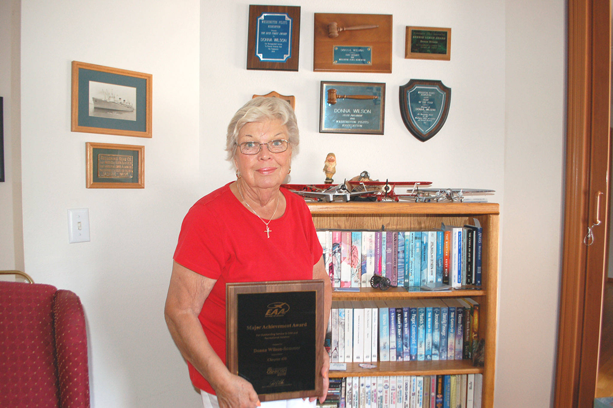 Among a handful of other aviation awards that hang on the walls of her home, Sequims Donna Wilson-Sommer is the Experimental Aircraft Association 2018 Major Achievement Award Winner for her many years of promoting aviation in her local communities. Sequim Gazette photo by Erin Hawkins