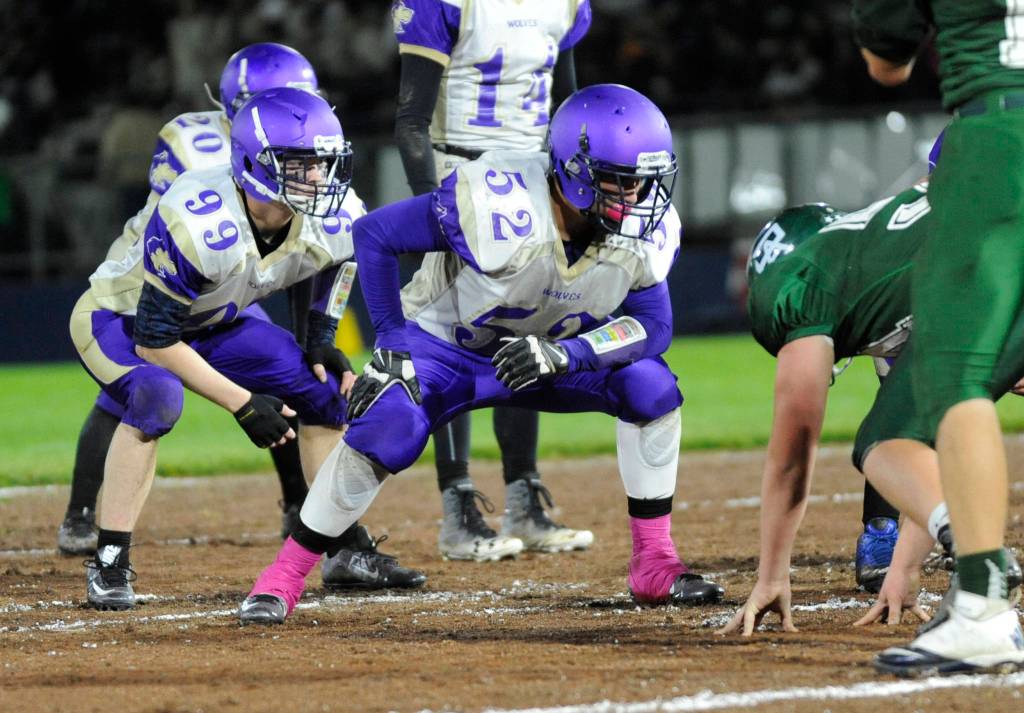 Senior Johnnie Young (52) anchors a Sequim line this fall. Young was named an all-Olympic League offensive lineman (second team) and an all-league first team linebacker on defense. Sequim Gazette file photo by Michael Dashiell