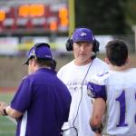Sequim head coach Erik Wiker looks to a crop of young players to help fill key skill positions, including his sophomore son Taig (right). Sequim Gazette file photo by Michael Dashiell