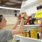 Emma Murphy, a Port Angeles High School student and Junior ROTC member, helps sort 2018 arts and crafts entries at the fairgrounds on Aug 13.