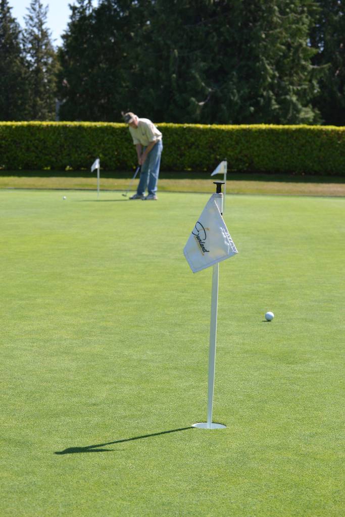 A visitor to the Sunland Golf & Country Club takes a shot on the putting green last week. Non-members can golf on the 18-hole course on Saturdays and Sundays, but club leaders said it hasnt helped as much as they hoped while the club faces tough choices with its financial future. Sequim Gazette photo by Matthew Nash