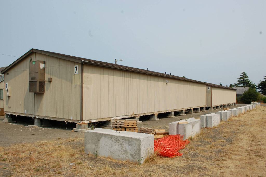 Sequim School District will use six portables from Central Kitsap School District to house its Olympic Peninsula Academy students temporarily as the districts new central kitchen is built. The portables will create 11 classrooms for OPA staff and students. Sequim Gazette photos by Erin Hawkins