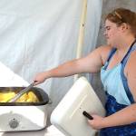 Lindsey Carlson, a majority member of the Sequim Rainbow Girls, readies some corn on the cob for the clubs annual booth at the fair. Carlson said shes been with Rainbow 14 years and she still loves the corn. It gets better every year, she said. Sequim Gazette photo by Matthew Nash
