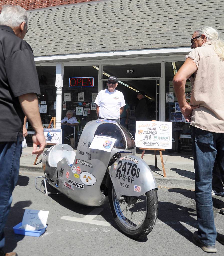George McMurray of Sequim shows off his record-setting motorcycle at the Sequim Prairie Nights event on Aug. 18. McMurray vies for world records at the Bonneville Speed Week in Utah each August.