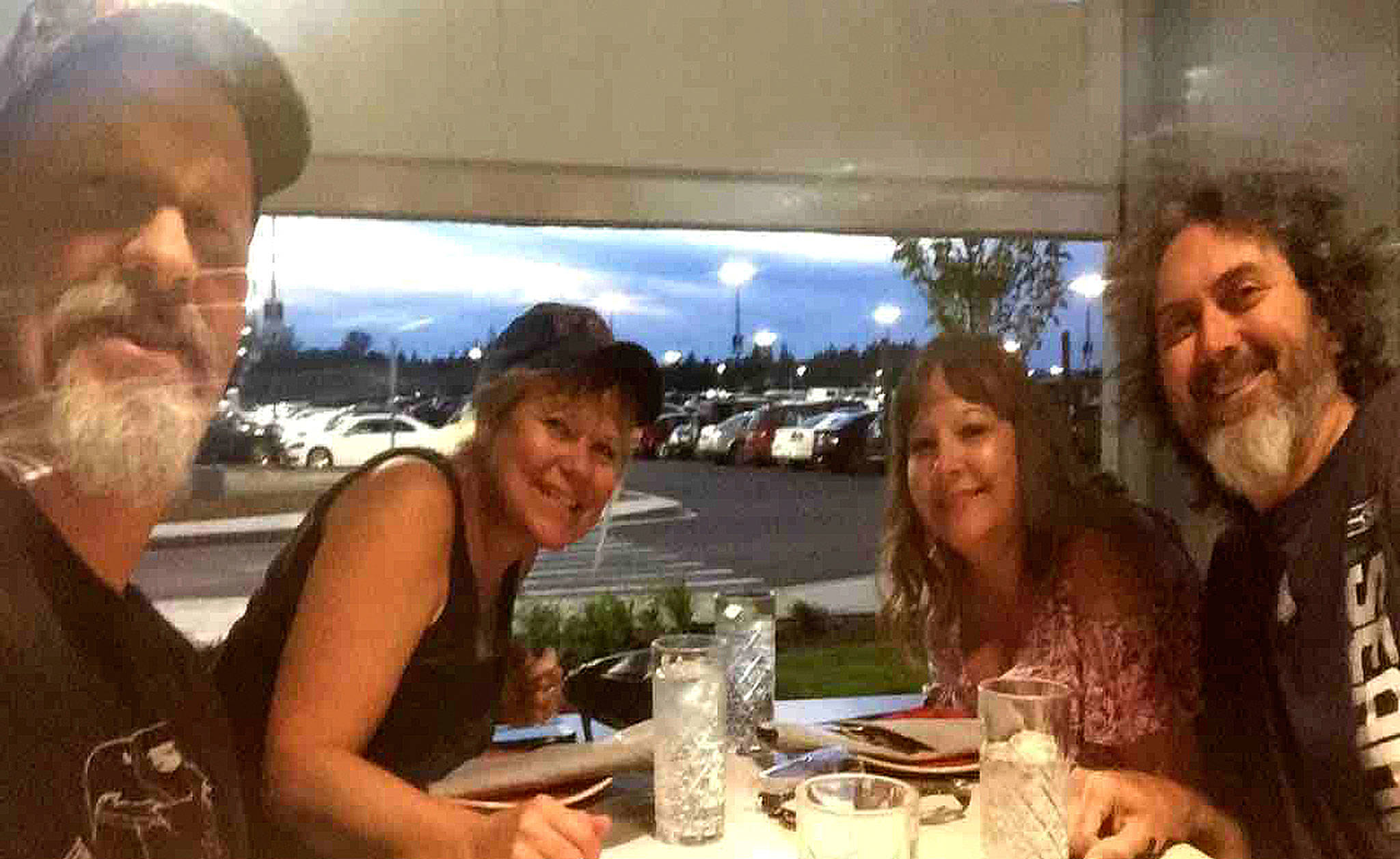 Family and friends, from left, Wayne and Brenda Priest of Sequim and Patti and Bill Neudorfer of Vancouver enjoy a meal together as they often did. The two couples were hit by a truck while riding their motorcycles on Aug. 18 in Cathlamet that took the lives of the Neudorfers, both Port Angeles natives, and hospitalized the Priests. Submitted photo