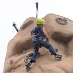 Tungsten Davis, 6, is all smiles after reaching the top of a climbing wall at the Aug. 25 Back to School Fair in Sequim. He and twin brother Tokgnar were both able to reach the top … twice.