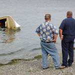 Capsized boat floats off shore of Gardiner Beach