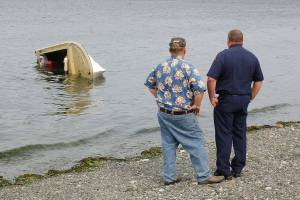 Capsized boat floats off shore of Gardiner Beach