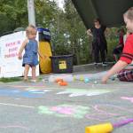 Josie Brocklesby, 15 months, enjoys some chalk before eating some lunch care of the Boys & Girls Clubs of the Olympic Peninsula and the US Department of Agricultures Summer Food Program for Children. Sequim Gazette photo by Matthew Nash