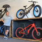 Garth Schmeck offers free rides, rentals, and sales of Pedego electric bikes in his new downtown shop Pedego Sequim. He said e-bikes help alleviate peoples fears of hills and distances. Sequim Gazette photo by Matthew Nash