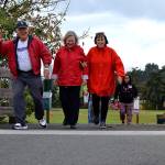 Bill Baughman, Becky Morgan and Linda Christensen walk for Trinity United Methodist Churchs team during the 5K Dungeness Valley Health & Wellness Clinics Community Fun Walk on Sept. 8. The trio said it was their first time participating in the walk in a few years. Sequim Gazette photo by Matthew Nash
