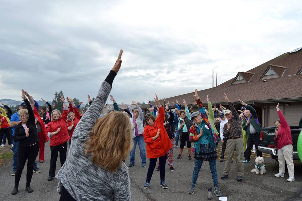 Walkers stretch before starting a 5K walk on Sept. 8 benefiting the Sequim Free Clinic. Sequim Gazette photo by Matthew Nash