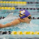 Anna Price of Sequim splashes to a strong finish in the 100 butterfly as the Wolves take on Olympic on Sept. 11. Sequim Gazette photo by Michael Dashiell