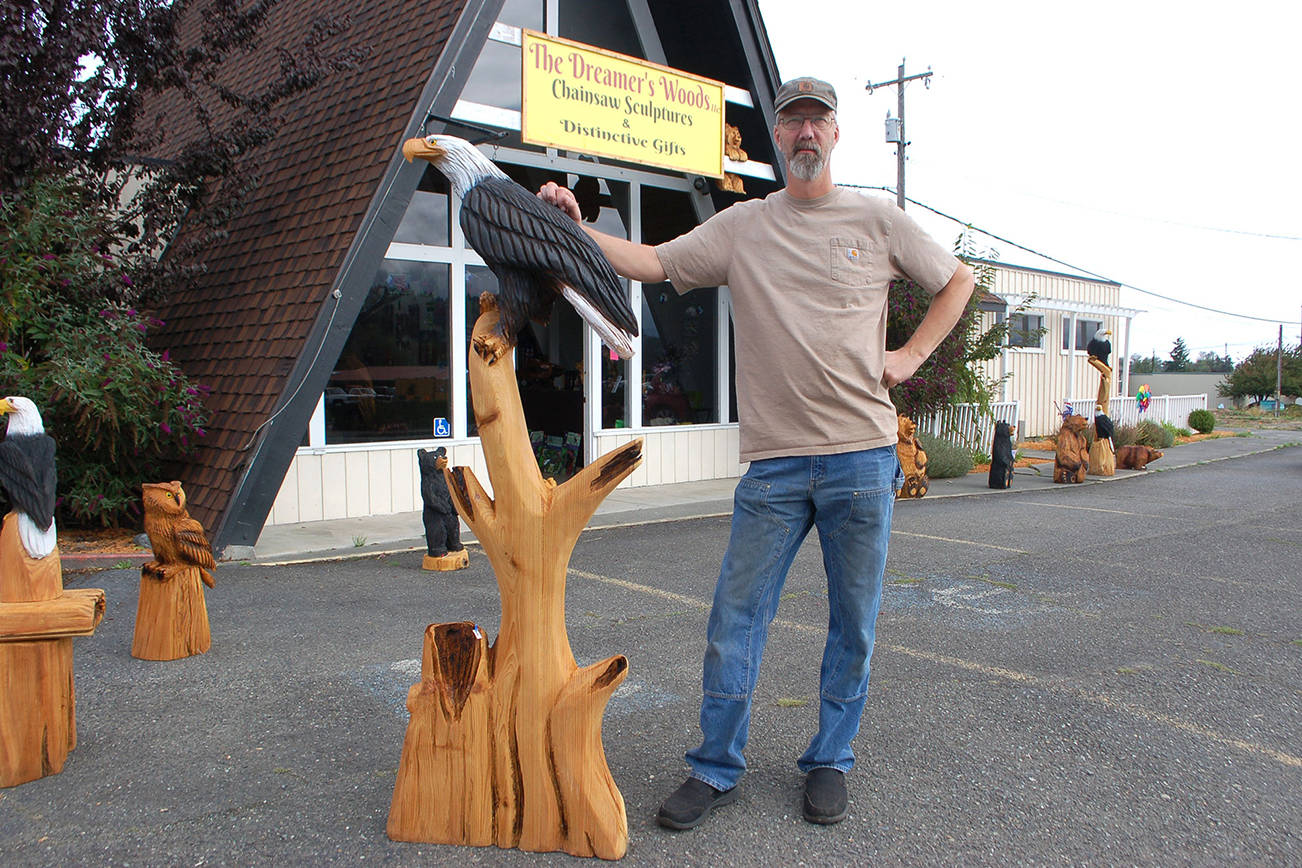Chainsaw artist Eric Berson opened his retail shop The Dreamers Woods in Sequim at 618 E. Washington St. He started chainsaw sculpting 16 years ago in Alaska and sells a variety of artwork both at his storefront in Sequim and in Alaska. Sequim Gazette photo by Erin Hawkins