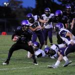 Sequims Taig Wiker (15) looks for running room in the Wolves 16-14 win over North Kitsap last week. Sequim Gazette photo by Michael Dashiell