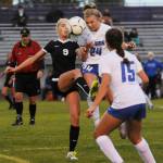 Sequims Eden Johnson (9) and Olympics Hanna Troy (24) vie for the ball in the first half of a Sept. 13 league match-up, as Olympics Aalysia Mitchell (15) looks on. Sequim Gazette photo by Michael Dashiell