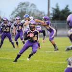 Sequim High quarterback Riley Cowan looks for running room in the Wolves win over North Mason last week. Cowan had 61 of Sequims 211 rushing yards. Sequim Gazette photo by Michael Dashiell