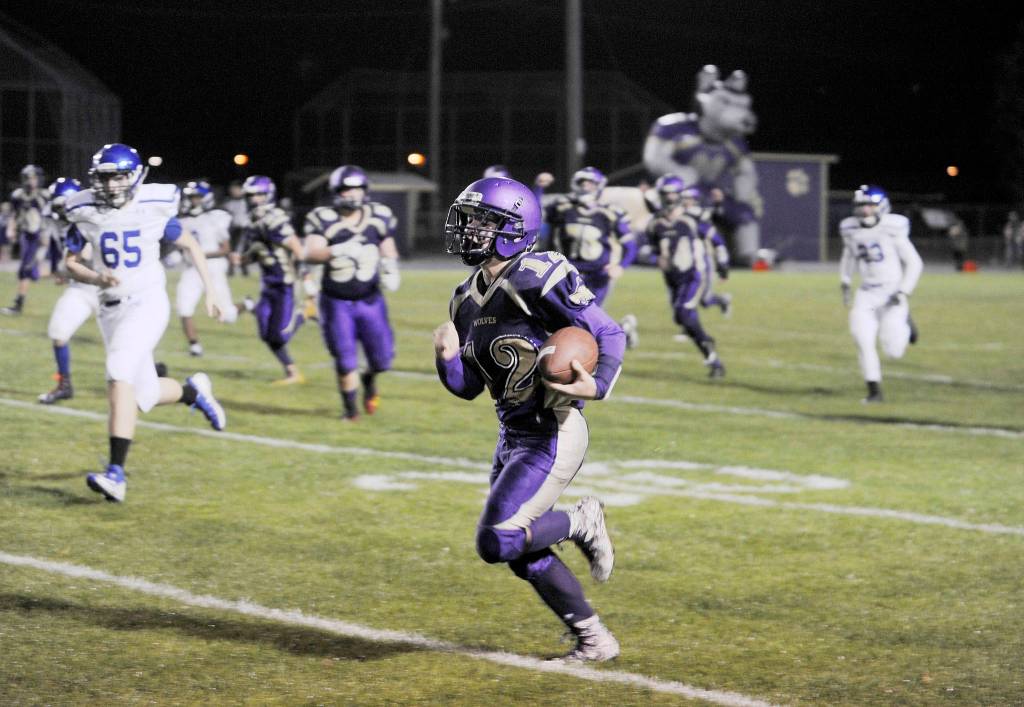 SHS punt returner Kyler Rollness races 60 yards for a score in the third quarter of the Wolves 20-0 win over North Mason on Sept. 21. Sequim Gazette photo by Michael Dashiell