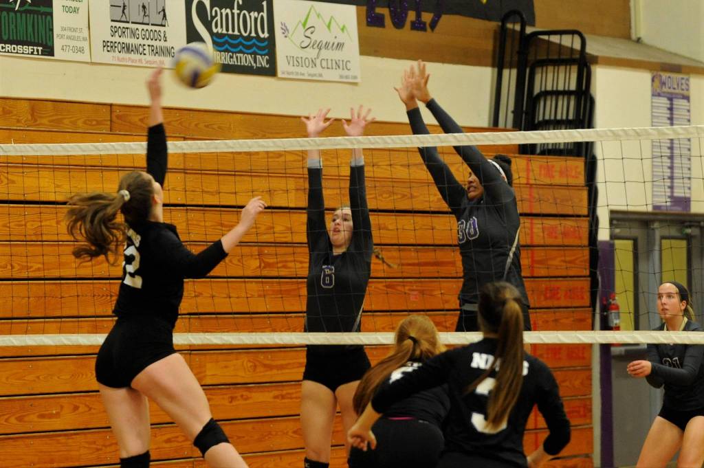 Sequims Brittany Gale (6) and Jayla Julmist (30) look to block a shot against North Mason on Sept. 25. Sequim Gazette photo by Matthew Nash