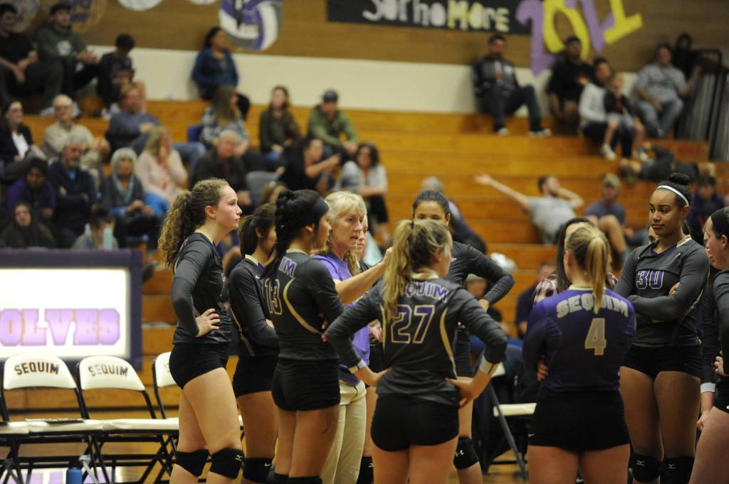 Coach Jennie Webber Heilman talks with her Wolves in Sequims five-set win over North Mason on Sept. 25. Sequim Gazette photo by Matthew Nash