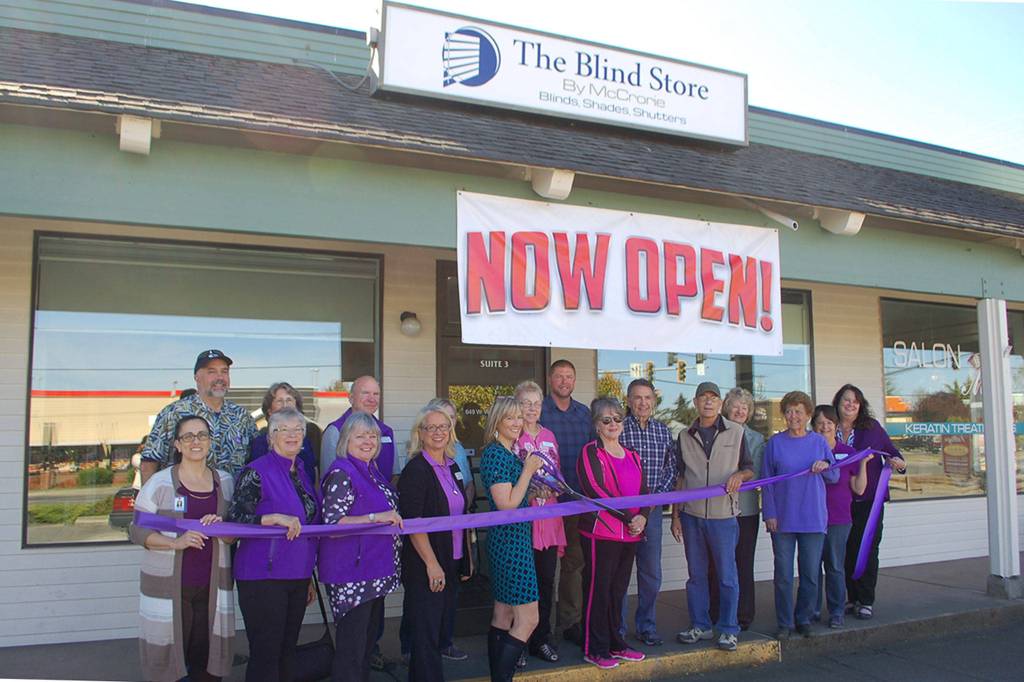 Members and ambassadors from the Sequim-Dungeness Valley Chamber of Commerce, City of Sequim, and other members of the community help co-owner of The Blind Store by McCrorie, David McCrorie, back row, center, and store staff cut the ribbon at the stores official opening on Sept. 27. Sequim Gazette photo by Erin Hawkins