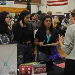 From left, Sequim High School students Madison Uranga, Lillian Richey and Nathalie Torres Mendoza speak with Lauren Hunter, an admissions counselor at Whitworth University at a college and career fair at SHS on Sept. 27. Sequim Gazette photo by Michael Dashiell