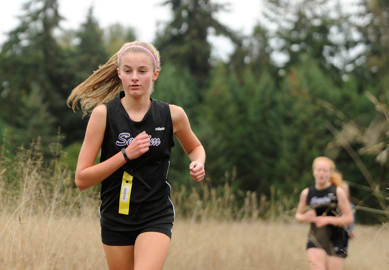 Cross country: Wolves sweep Redhawks, Trojans in home league meet