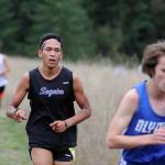 Sequims Trey Brouillard, center, competes against Olympic and Port Townsend at Robin Hill County Park on Oct. 4. Sequim Gazette photo by Michael Dashiell