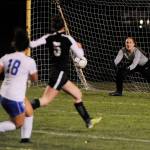 As Sequim defender Mary McAleer looks on, SHS goalkeeper Olivia Hare makes a save on a shot by Bremertons Ammaya Robinette in the first half of Sequims 3-0 win against the Knights on Oct. 4. Sequim Gazette photo by Michael Dashiell