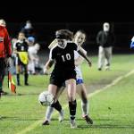Sequim defender Gabby Happe keeps the ball away from a Bremerton striker in the first half of Sequims 3-0 win on Oct. 4. Sequim Gazette photo by Michael Dashiell