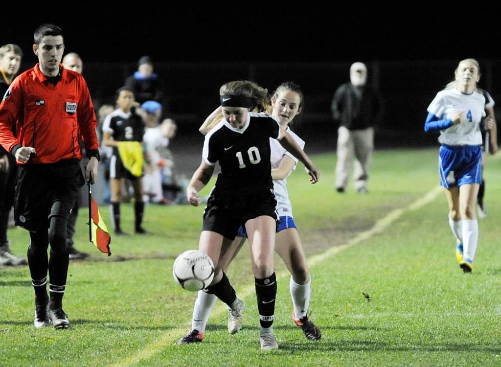 Sequim defender Gabby Happe keeps the ball away from a Bremerton striker in the first half of Sequims 3-0 win on Oct. 4. Sequim Gazette photo by Michael Dashiell