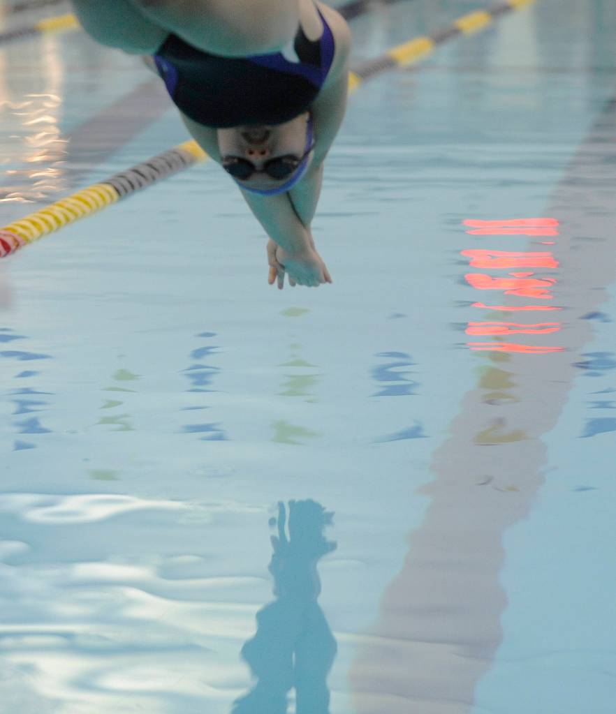 Sequims Sonja Govertsen gets a good start on her way to a personal best in the 50 freestyle against North Kitsap on oct. 4; her 25.35-second mark is a state 2A-meet qualifyng time. Sequim Gazette photo by Michael Dashiell