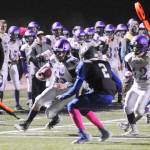 With teammates looking on, Sequim running back Taig Wiker turns a short screen into a big gain. Wiker racked up 258 yards on35 carries in the Wolves 28-9 win at Olympic on Oct. 5. Sequim Gazette photo by Michael Dashiell