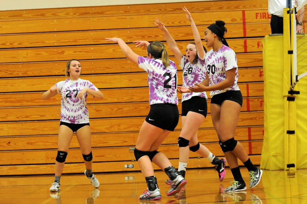 Sequim players Bobbi Sparks (27), Kalli Wiker (21), Tayler Breckenridge (28) and Jayla Julmist (30) celebrate a point in the Wolves Oct. 11 match-up with North Kitsap. Sequim Gazette photo by Matthew Nash                                Sequim players Bobbi Sparks (27), Kalli Wiker (21), Tayler Breckenridge (28) and Jayla Julmist (30) celebrate a point in the Wolves Oct. 11 match-up with North Kitsap. Sequim Gazette photo by Matthew Nash