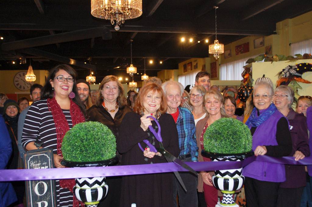 Decorate with Panaches owner, Susan Eiland, center, cuts the ribbon with her new stores staff, family, friends and members from the Sequim-Dungeness Chamber of Commerce on Oct. 5 at the stores official opening at 154 W. Washington St. Sequim Gazette photo by Erin Hawkins
