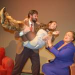 Edwin J. Anderson III, playing the role of Greg, left, holds Melissa Karapostoles, playing the dog Sylvia, as Jennifer Horton plays the role of Kate in Olympic Theatre Arts modern romantic comedy Sylvia. The three actors say they consider each other family. Sequim Gazette photo by Erin Hawkins