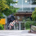 A cyclist makes his way across the Peninsula College campus in Port Angeles last week. Peninsula College announced Monday it will receive a $2.2 million grant from the federal Department of Education. Photo by Jesse Major/Peninsula Daily News