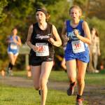 Sequims Taylor Coleman, left, sets a personal 5k best at the 2018 Olympic League cross country on Oct. 18. Sequim Gazette photo by Michael Dashiell