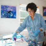 From start to finish, artist Melanie Burns says paint in acrylic pouring continues to move around on the canvas due to chemical reactions in her paint mixture, blending colors in a unique way. She demos a dirty pour on a canvas in her Sequim studio. Sequim Gazette photo by Erin Hawkins