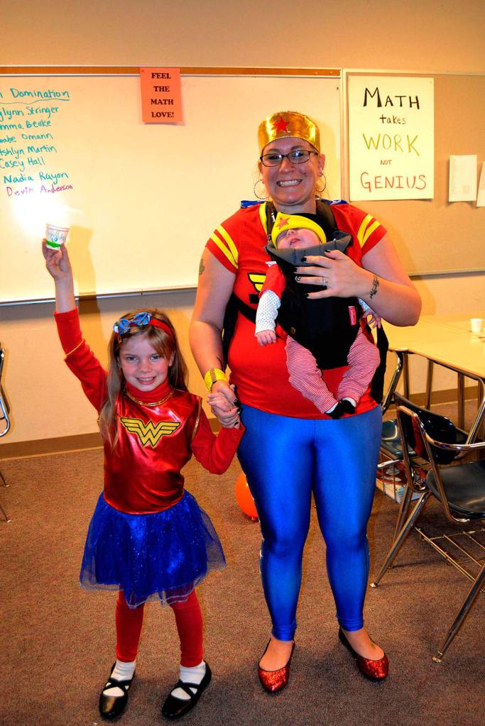 Sequim Wonder Women Piper, Laila, and mom Rebekah Jackson strike a super pose at Haunted Hallways in 2017. The event continues this year from 1-4 p.m. Saturday, Oct. 27. Sequim Gazette file photo by Matthew Nash