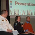 Clallam County Fire District 3 Chief Ben Andrews, left, and City manager Charlie Bush, right, listen as Sequim Police Chief Sheri Crain discusses how the police department tackles prevention methods for community emergencies. Sequim Gazette photo by Erin Hawkins