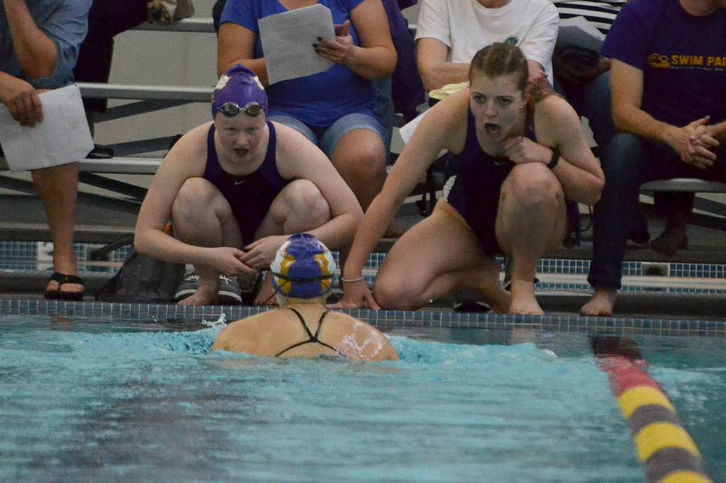 Heidi Schmitt and Madeline Patterson cheer for Natalie George during the 200 individual medley.