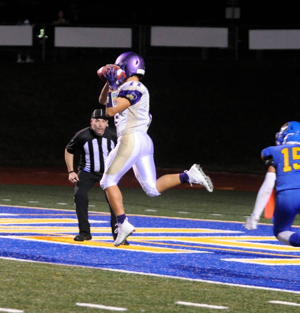 Sequim receiver Michael Young leaps and snags a 29-yard TD pass from Riley Cowan in the Wolves league win at Bremerton on Oct. 26. Young had seven catches for 136 yards and two scores in the win. Sequim Gazette photo by Michael Dashiell