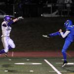 Sequims Ben Cowan, left, tries to block a punt by Bremertons Zachary Storey. Sequim Gazette photo by Michael Dashiell