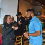 Sequim Police Chief Sheri Crain speaks with Lorenzo Earl, a manager with AT&T, during the Coffee with a Cop meet-and-greet at Starbucks on Oct. 23. Sequim Gazette photo by Matthew Nash