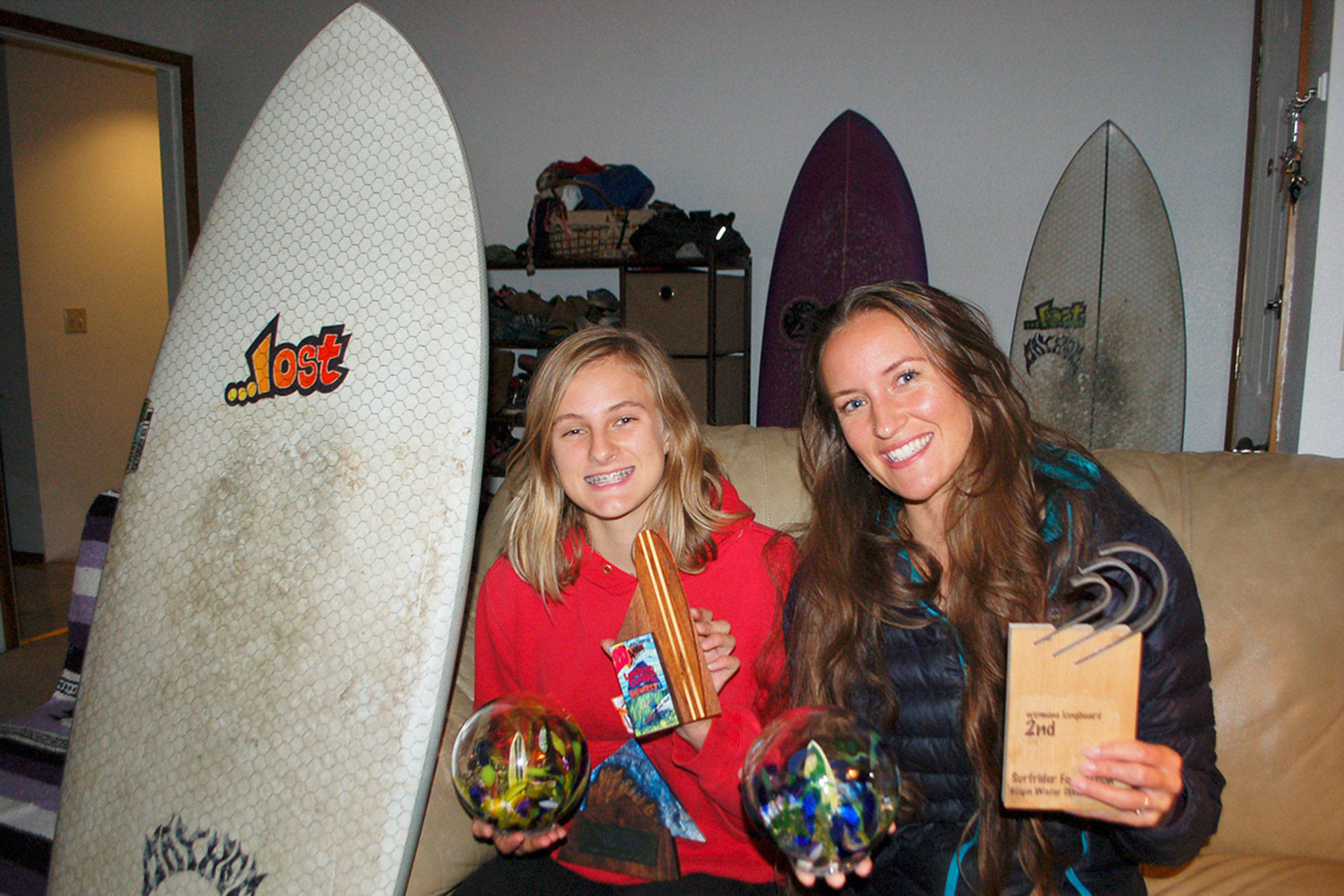 Gemma Davis, 16, left, followed in her mother Melissa Davis footsteps as a competitive surfer living in Sequim. Both mother and daughter share a passion for the sport and enjoy traveling to competitions up and down the West Coast. Sequim Gazette photo by Erin Hawkins