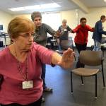 Tai Ji Quan continues at the YMCA through Olympic Medical Centers Wellness Services program. Here, participants, from left, Helen Butler, Peggy Scheideler, physical therapist, Sandy Sullivan, Sarah Thomas, Peggy Dawson, and Richard Thomas move together in the 23rd week of a 24 week class to help prevent falls. Sequim Gazette photo by Matthew Nash