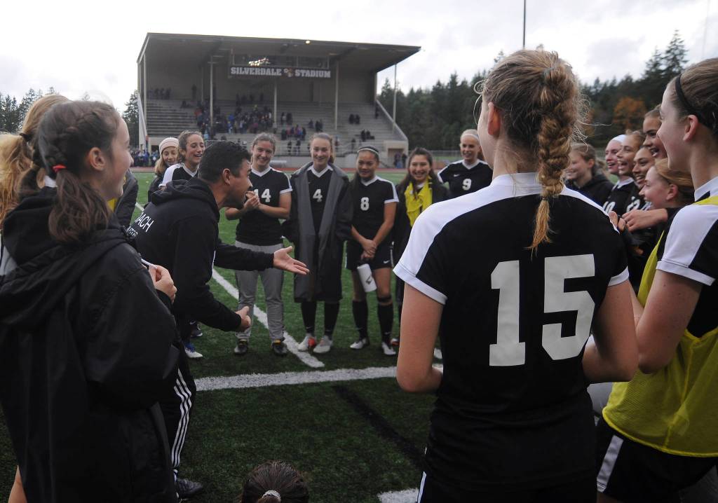 Sequim Highs girls soccer squad gets a postgame pep talk from assistant coach Antonio Frutos. Sequim Gazette photo by Michael Dashiell