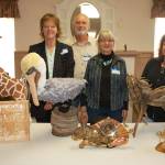 Olympic Theatre Arts sets the stage for Heart for the Arts an annual fundraiser that promotes a variety of artists in the Sequim community. A few of the live auction contributing artists, from left, are Terri Biondolino with Hanka pelican sculpture of felt fiber, David Johannessohn, Toy Buillon, with her and her husband Tims (not pictured) piece Rabbit Clock made from wood and random items, and Tammy Hall with her driftwood sculpture Pegasus. Sequim Gazette photo by Erin Hawkins